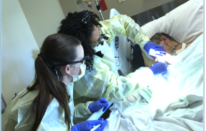 Sheba Jones, RDH, and dental hygiene student providing oral care