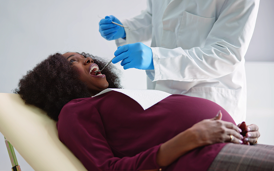 Image of pregnant woman getting a dental exam