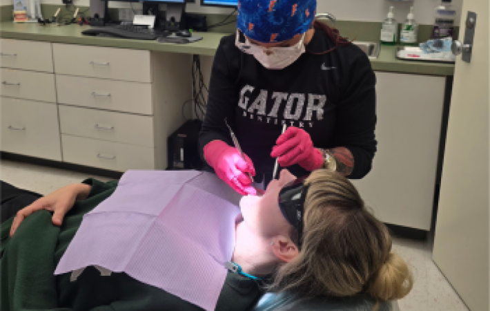 Mary Lynne Davis looking into patient's mouth