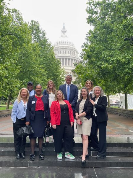 Group of Ten Professionals Posing on Steps with the U.s. Capitol Building in the Background (professional Attire)