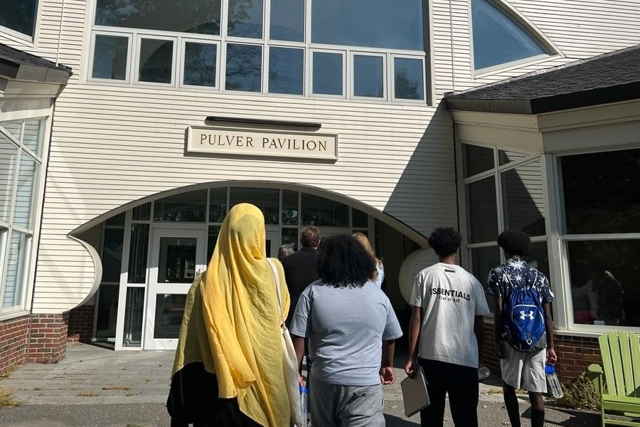 CHWs walking into building